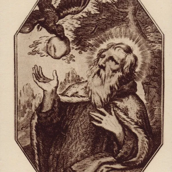 An engraving of a bearded man in robes with a halo looks up at a bird offering bread. The scene conveys reverence. Floral border on black background.